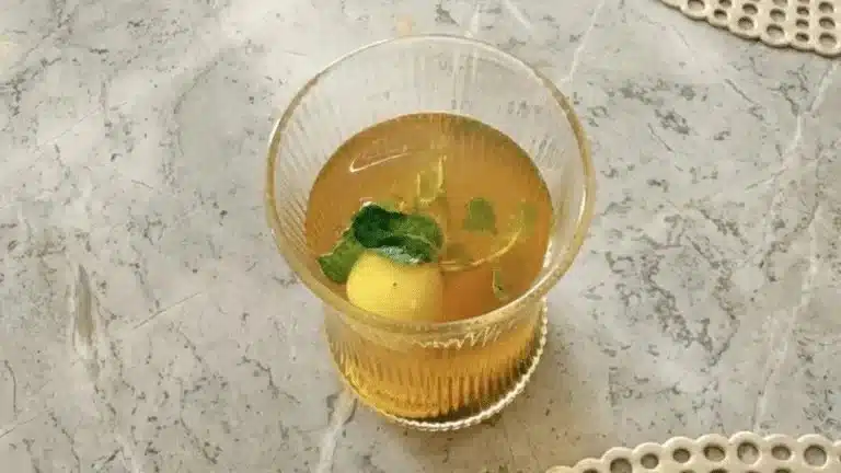 A steaming cup of tea on a wooden table, symbolizing comfort and relaxation.