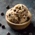 Single-serve chocolate chip edible dough in a bowl with chocolate chips