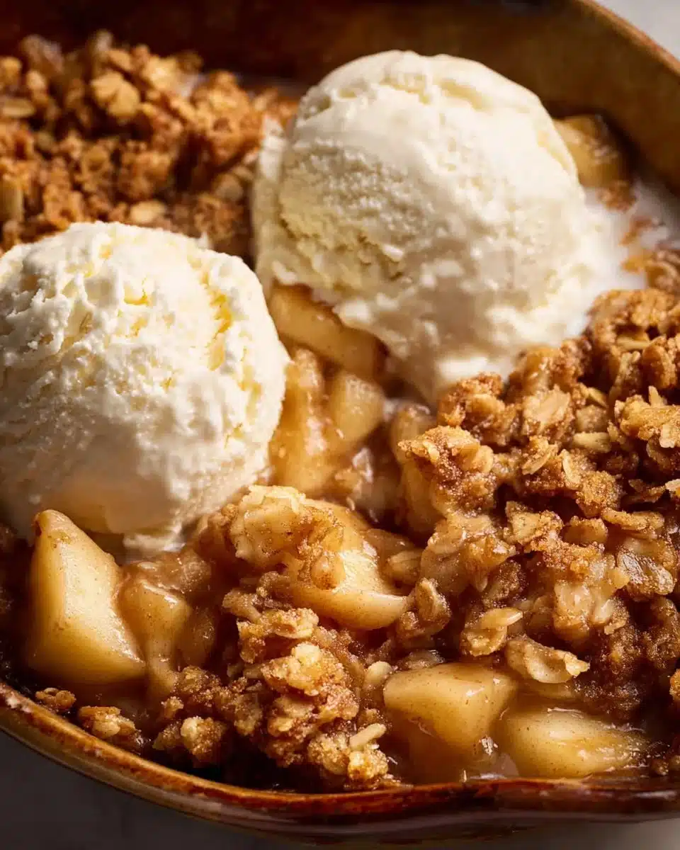 Freshly baked apple crumble dessert topped with crispy streusel