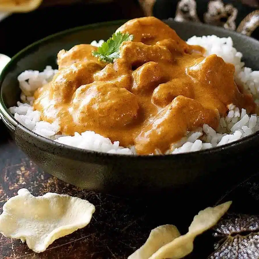 Butter Chicken 1 Delicious butter chicken served with rice and naan bread
