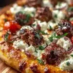 Sausage Feta Pizza topped with savory sausage and crumbled feta cheese
