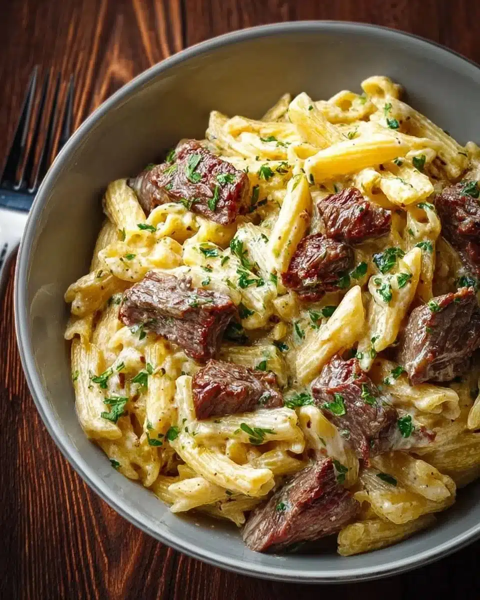 Delicious plate of Silky Creamed Steak Pasta with tender steak and creamy sauce